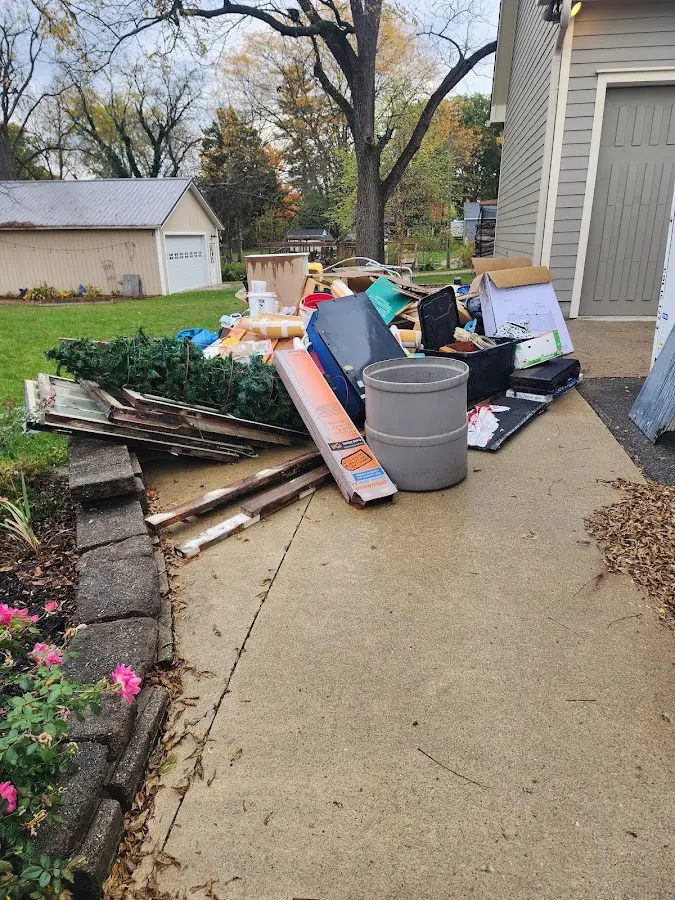 Dumpster being loaded with debris for Roofing Dumpster Rental in Glen Allen